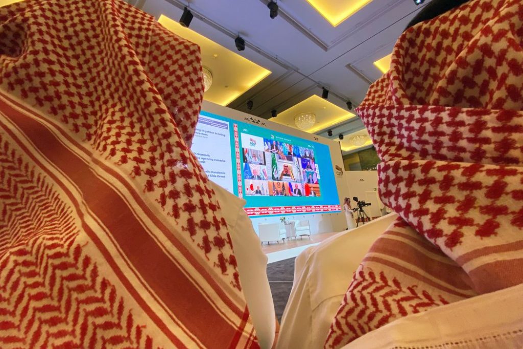 Journalists watch Saudi King Salman bin Abdulaziz's virtual speech live at the media centre during an opening session of the 15th annual G20 Leaders' Summit in Riyadh, Saudi Arabia November 21, 2020. REUTERS/Nael Shyoukhi