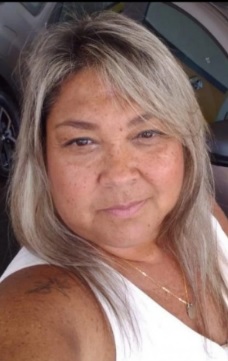 Cláudia Lobo Pinheiro tinha 54 anos e levou um tiro ao tentar fugir dos bandidos/Reprodução